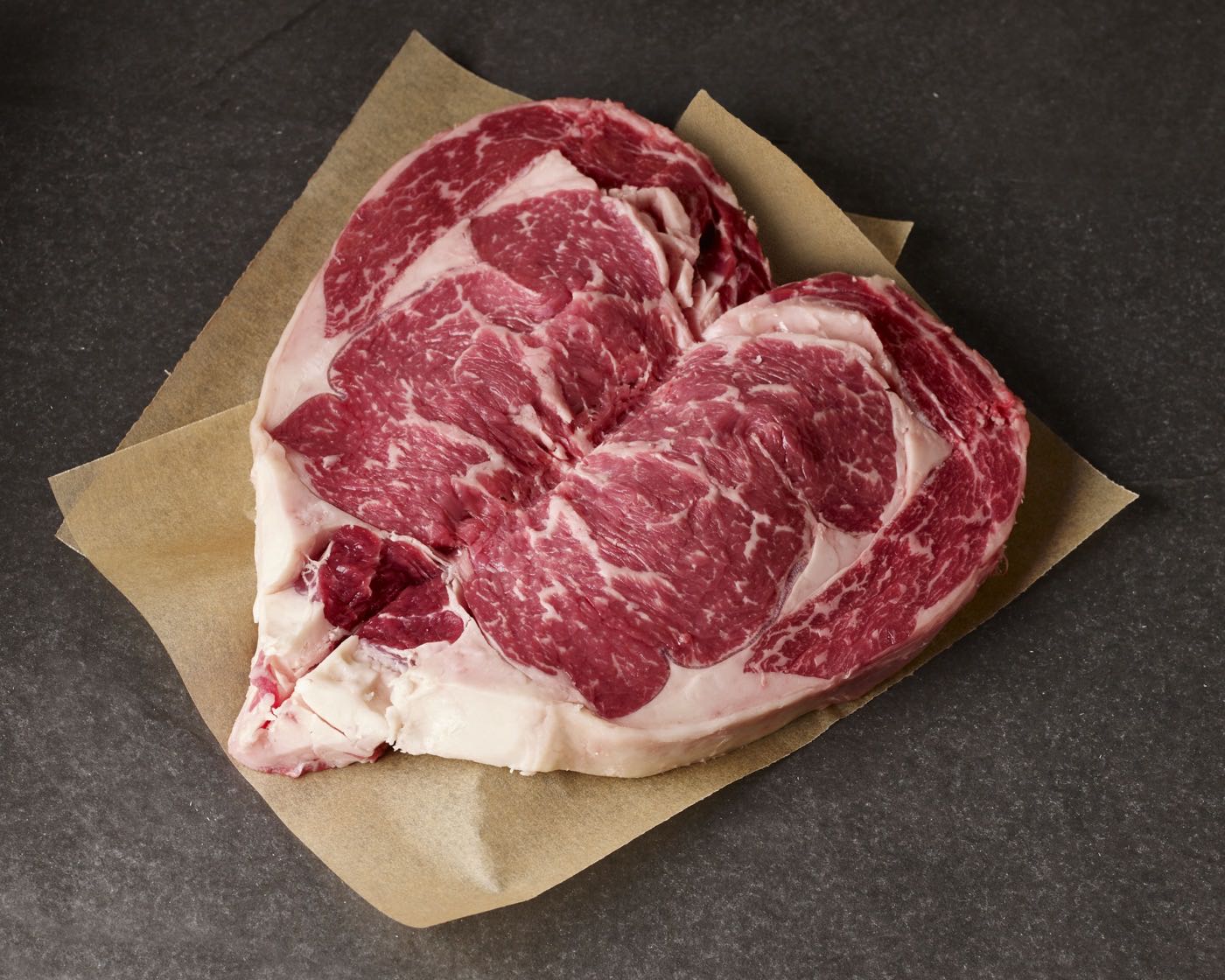 heart-shaped-ribeye-steak-on-butcher-paper